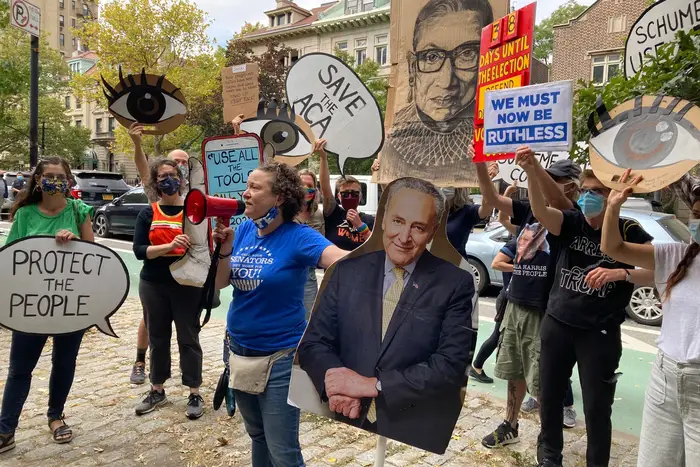 Protesters on Park Slope West with signs on September 26th, 2020.